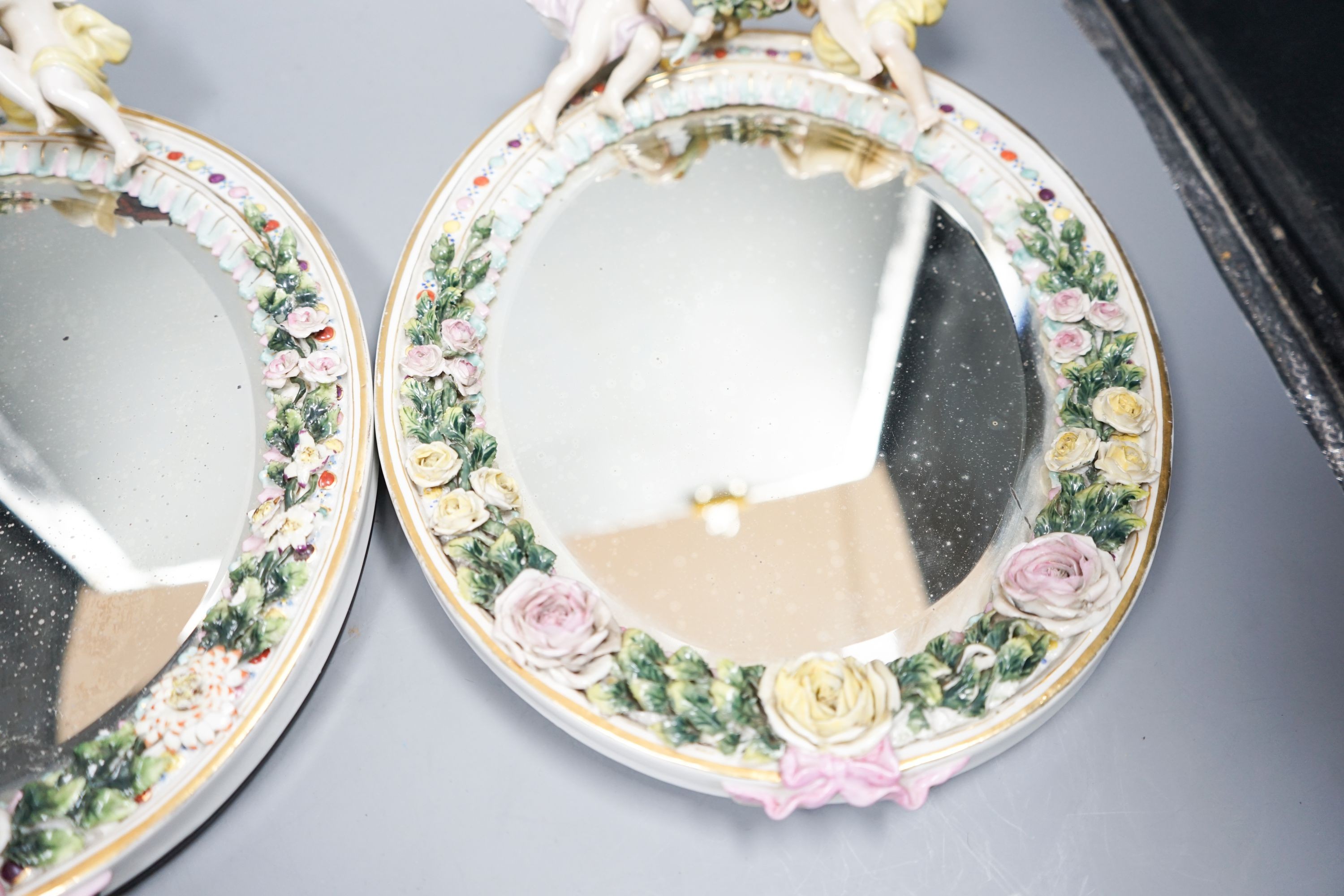 A pair of Sitzendorf oval mirror frames, 33cm